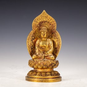 A BRONZE-GILT SEATED MEDICINE BUDDHA