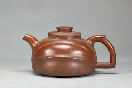 A YIXING GLAZE ZISHA TEAPOT