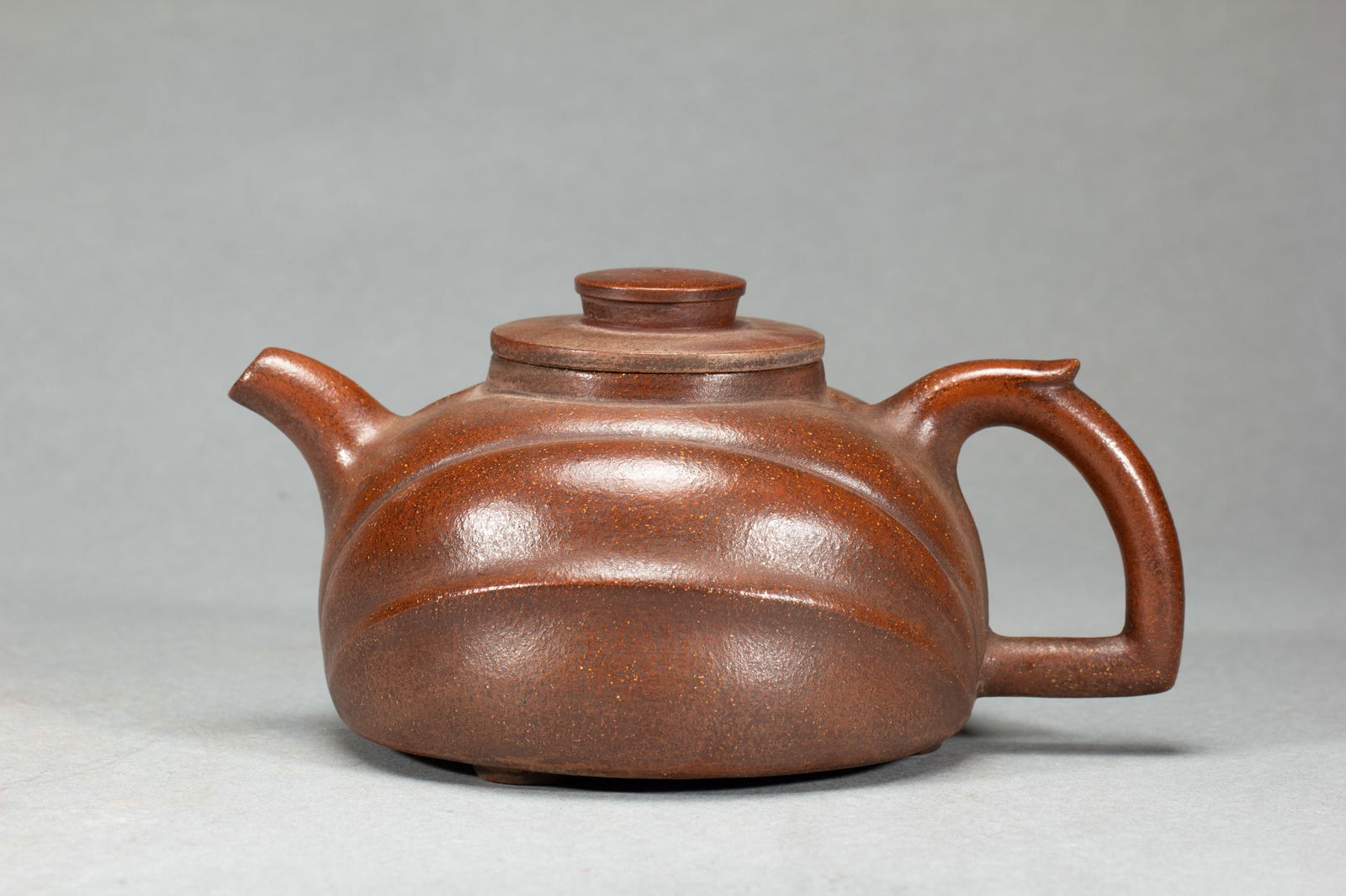 A YIXING GLAZE ZISHA TEAPOT (1 of 9)