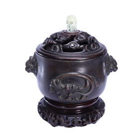 A BRONZE CENSER WITH COVER