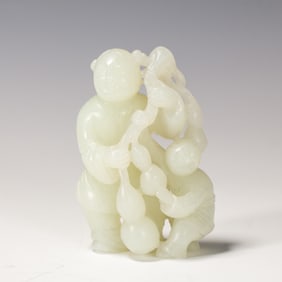 A CARVED WHITE JADE BOYS GROUP