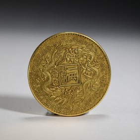 A CHINESE SILVER-GILT COIN