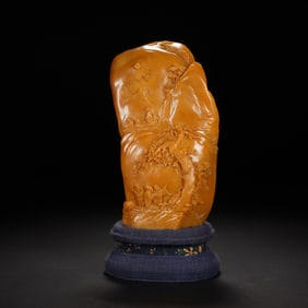 A CARVED TIANHUANG BOULDER