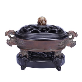 A BRONZE CENSER WITH COVER