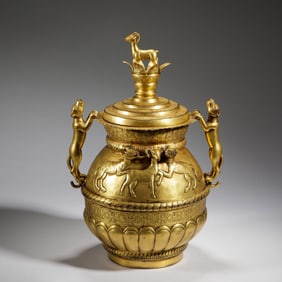 A BRONZE-GILT BEAST VESSEL
