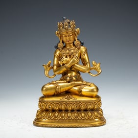 A TIBETAN BRONZE-GILT FIGURE OF VAJRADHARA