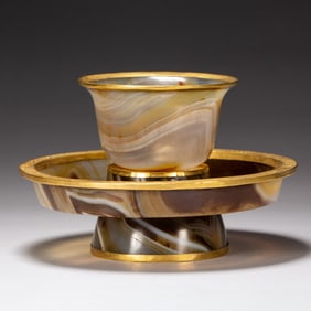 A CARVED AGATE CUP WITH STAND