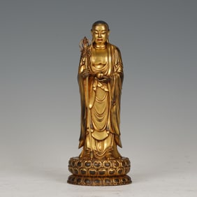 A BRONZE-GILT STANDING KSITIGARBHA