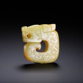 A CHINESE ARCHAISTIC JADE CARVING OF DRAGON