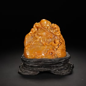 A CARVED TIANHUANG CHILONG GROUP BOULDER