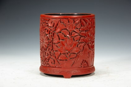A CARVED CINNABAR LACQUER BRUSHPOT