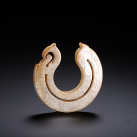 A CARVED JADE ORNAMENT