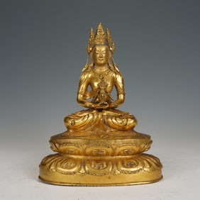 A TIBETAN BRONZE-GILT SEATED AMITABHA