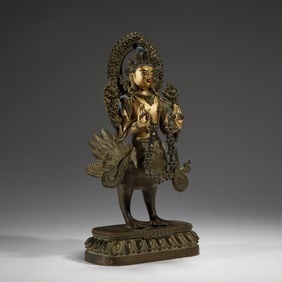 AN EXTREMELY RARE SINO-TIBETAN BRONZE MAHAMAYURI