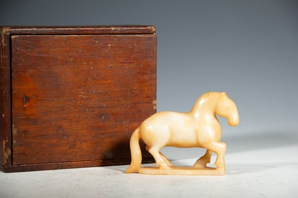 A CARVED JADE HORSE