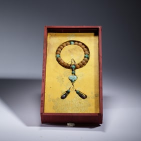 A CHINESE IMPERIAL CARVED AGATE PRAYER BEADS