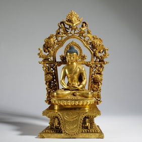 A RARE BRONZE-GILT SEATED AMITABHA