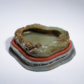 A CARVED JADE PINE WASHER