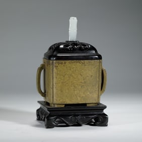 A BRONZE CENSER WITH COVER