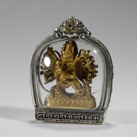 A BRONZE-GILT YAMANTAKA AMULET