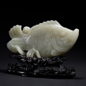 A CARVED WHITE JADE CARP