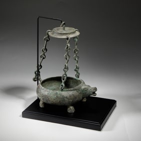 A BRONZE BEAST FORM VESSEL WITH COVER