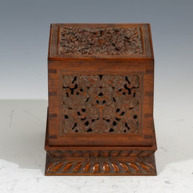 A CARVED HUANGHUALI BOX WITH COVER