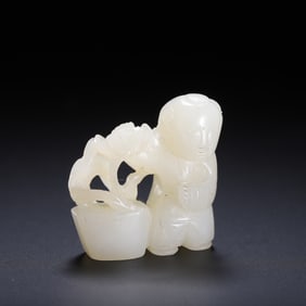 A CARVED WHITE JADE BOY