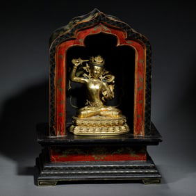 A BRONZE-GILT FIGURE OF MANJUSRI