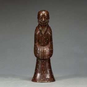 A GOLD AND SILVER INLAID BRONZE STANDING FIGURE