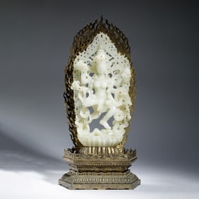 A CARVED WHITE JADE DAKINI