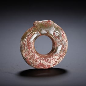 A CHINESE ARCHAISTIC JADE CARVING OF DRAGON