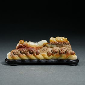 A CARVED JADE BRUSHREST