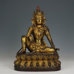 A BRONZE-GILT SEATED AVALOKITESVARA