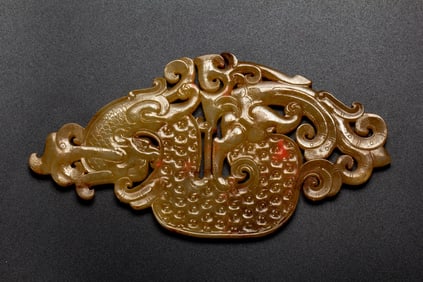 A CARVED JADE PHOENIX ORNAMENT