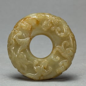 A CARVED JADE CHILONG GROUP DISC BI