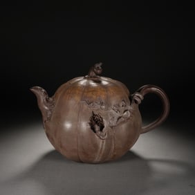 A YIXING GLAZE ZISHA TEAPOT