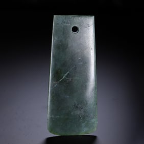 A JADE CARVING OF AXE