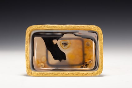A CARVED AGATE WASHER