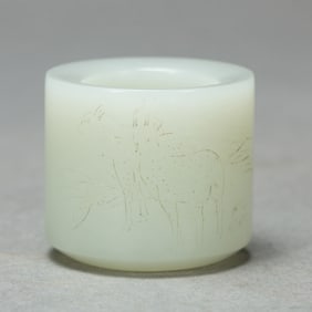 A CHINESE WHITE JADE ARCHER RING