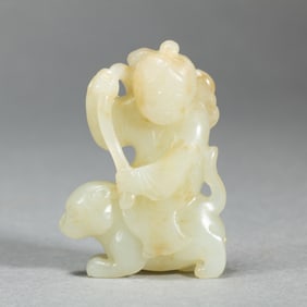 A CARVED WHITE JADE BOY DECORATION