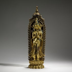 A BRONZE-GILT STANDING BODHISATTVA