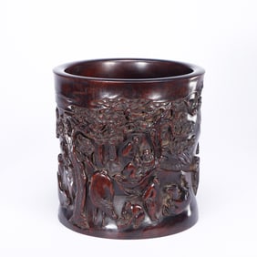 A CARVED ANATTOS-WOOD FIGURAL STORY BRUSHPOT