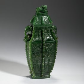 A FINE ARCHAISTIC CARVED SPINACH GREEN JADE VASE WITH COVER