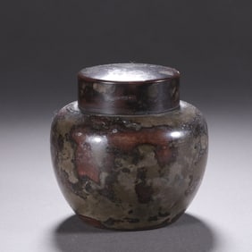 A TIN-WARE TEA CADDY WITH COVER