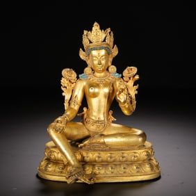 A BRONZE-GILT SEATED GREEN TARA