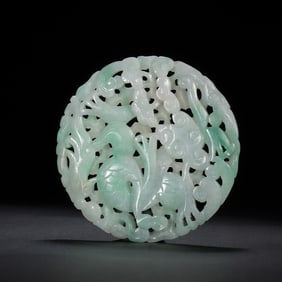 A CARVED JADEITE PLAQUE
