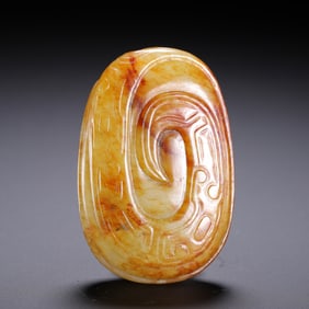 A CARVED JADE PENDANT