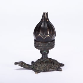 A BRONZE TORTOISE LAMP HOLDER