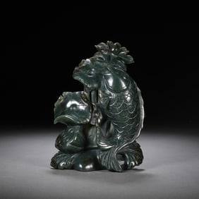 A CARVED SPINACH GREEN JADE CARP WITH LOTUS